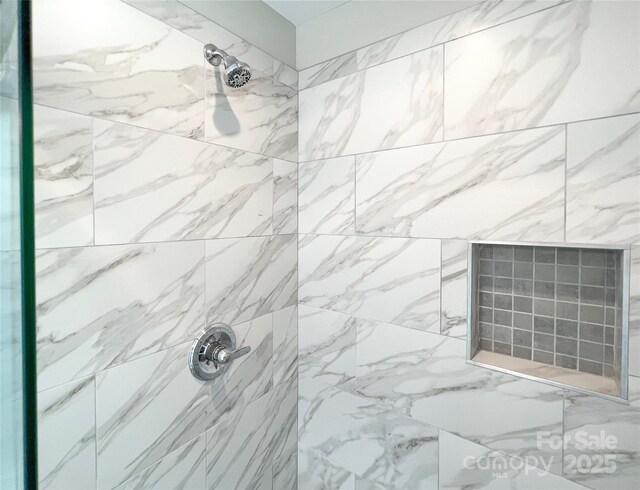bathroom view of tiled shower