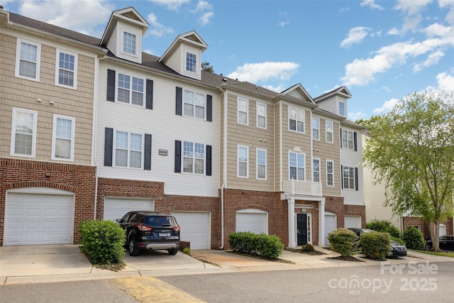 6912 Park Place Dr, Charlotte, NC 28262 - townhome / multi-family property with an attached garage, brick siding, and driveway