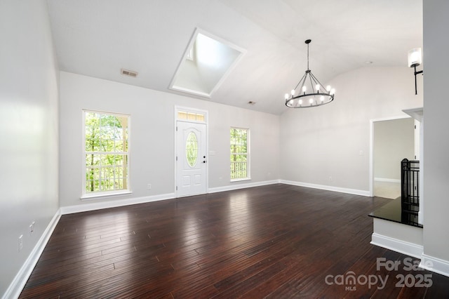 62 Mackenzie Way, Swannanoa, NC 28778 - unfurnished living room with vaulted ceiling, plenty of natural light, and dark wood-type flooring