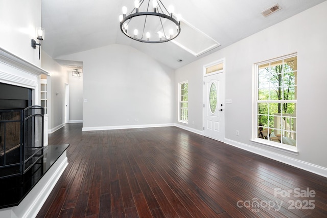 62 Mackenzie Way, Swannanoa, NC 28778 - unfurnished living room with visible vents, plenty of natural light, an inviting chandelier, and vaulted ceiling