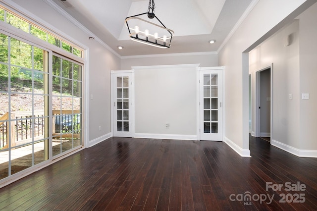 62 Mackenzie Way, Swannanoa, NC 28778 - unfurnished dining area featuring baseboards, ornamental molding, dark wood-style flooring, and a notable chandelier