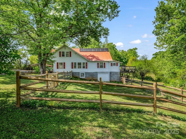 exterior space featuring fence and a yard