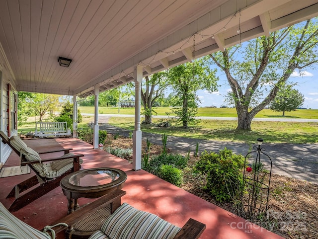 view of patio featuring a porch