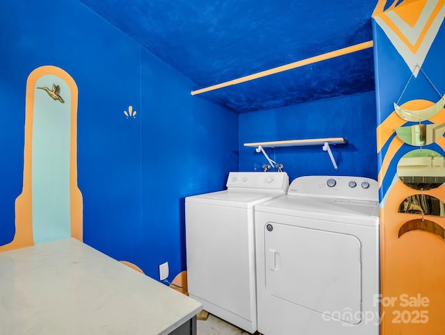 laundry room with laundry area and washer and clothes dryer