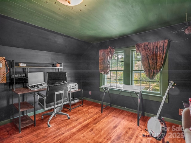 office space featuring baseboards, wood ceiling, and wood finished floors
