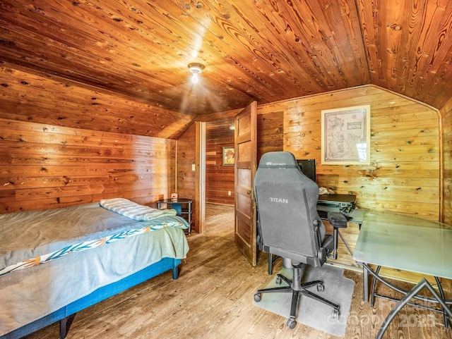 bedroom with wood ceiling, wood walls, wood finished floors, and lofted ceiling