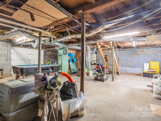 unfinished basement with pool table