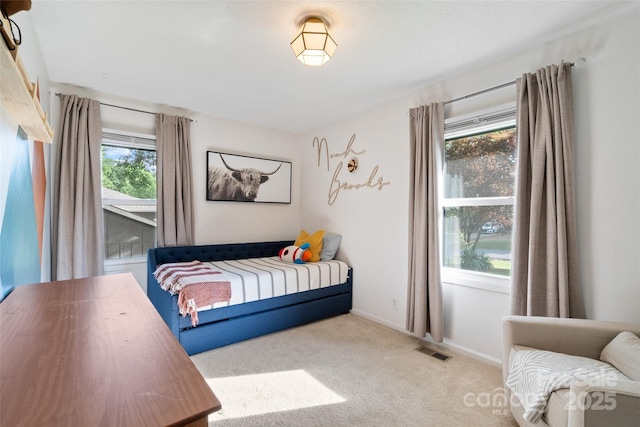 bedroom featuring carpet flooring, baseboards, and visible vents