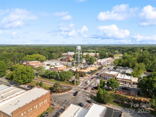 birds eye view of property with a forest view