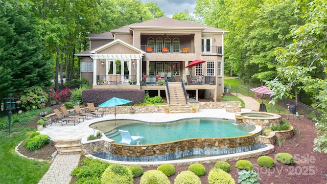 135 Sumter Dr, Mooresville, NC 28117 - rear view of house featuring stairway, fence, a balcony, a patio, and stucco siding