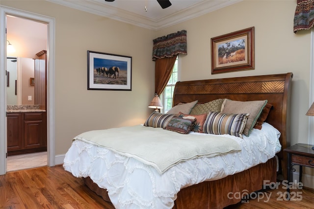 135 Sumter Dr, Mooresville, NC 28117 - bedroom with light wood-style floors, ornamental molding, a ceiling fan, and ensuite bath