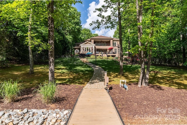 135 Sumter Dr, Mooresville, NC 28117 - rear view of house featuring fence, a yard, and a deck