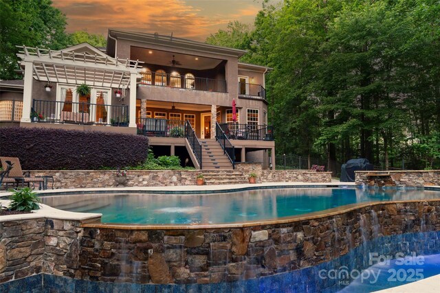 135 Sumter Dr, Mooresville, NC 28117 - view of pool featuring stairway, a deck, and an infinity pool