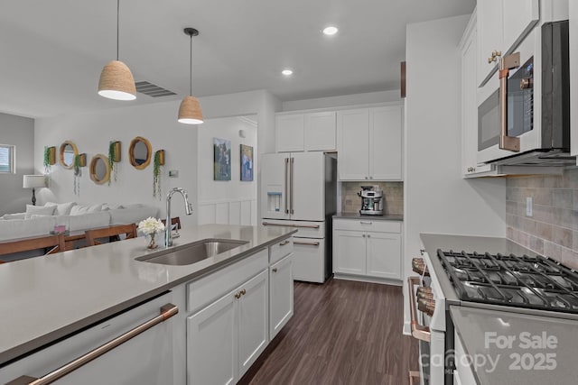 7620 Porrera St, Charlotte, NC 28214 - kitchen featuring stainless steel appliances, visible vents, a sink, and tasteful backsplash