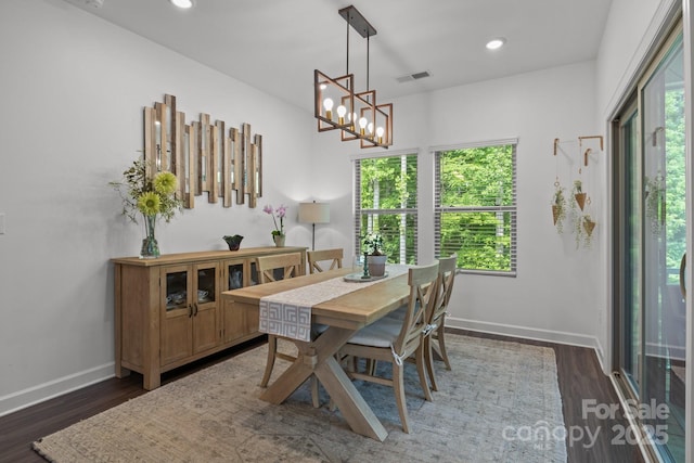 7620 Porrera St, Charlotte, NC 28214 - dining area featuring baseboards, a wealth of natural light, dark wood finished floors, and visible vents