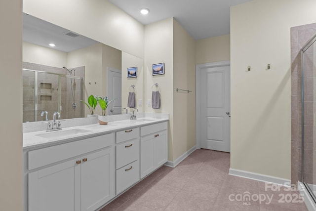 7620 Porrera St, Charlotte, NC 28214 - full bathroom featuring visible vents, a sink, tile patterned floors, and a shower stall