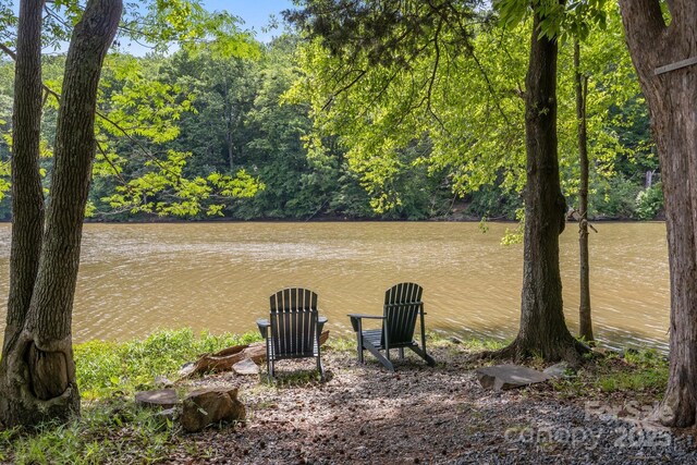 7620 Porrera St, Charlotte, NC 28214 - exterior space with a water view and a wooded view