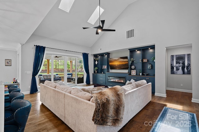 7730 Burning Ridge Dr, Stanley, NC 28164 - living room featuring a skylight, ceiling fan, high vaulted ceiling, wood finished floors, and baseboards