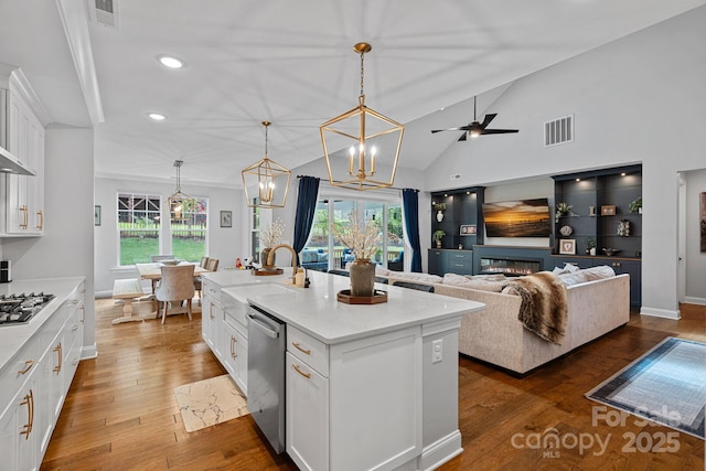 7730 Burning Ridge Dr, Stanley, NC 28164 - kitchen featuring stainless steel appliances, white cabinetry, recessed lighting, light countertops, and pendant lighting