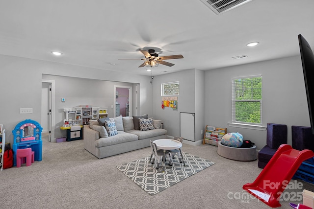 7730 Burning Ridge Dr, Stanley, NC 28164 - carpeted living room with a ceiling fan and recessed lighting