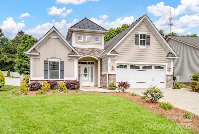 craftsman house featuring a standing seam roof, a front yard, a garage, concrete driveway, and stone siding