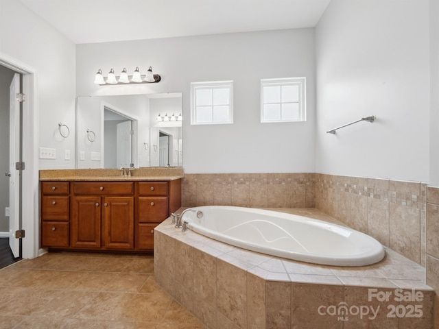 full bathroom with vanity and a bath