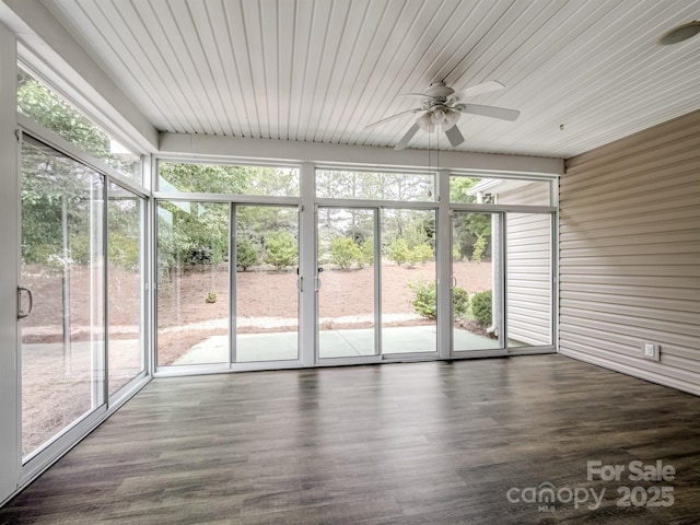 unfurnished sunroom with ceiling fan