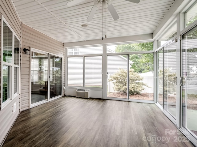 unfurnished sunroom featuring ceiling fan