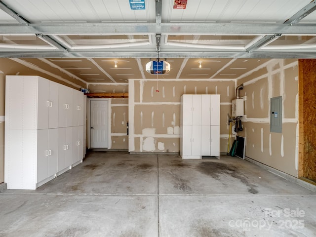 garage with water heater, a garage door opener, and electric panel