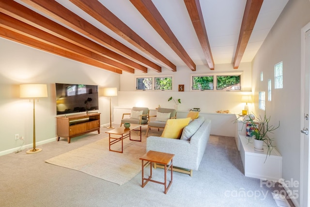 carpeted living room with baseboards, plenty of natural light, and beam ceiling