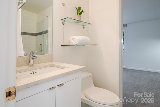 full bathroom featuring vanity, a stall shower, and toilet