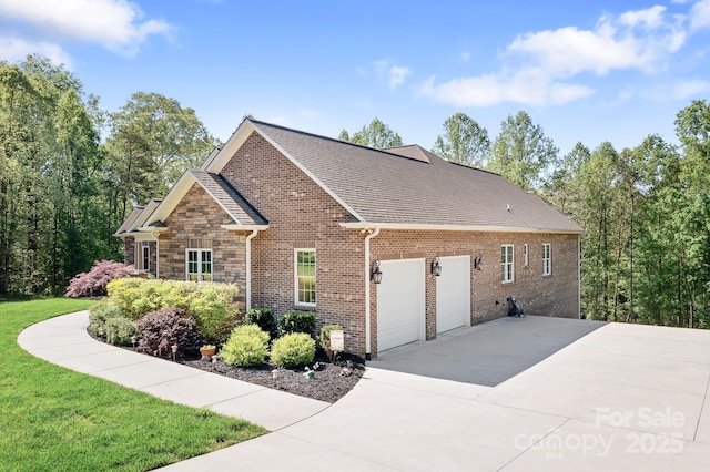 view of home's exterior featuring roof with shingles, an attached garage, stone siding, brick siding, and concrete driveway