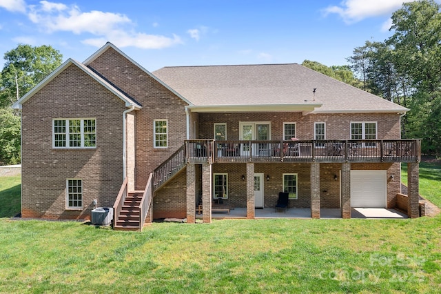 rear view of house featuring stairs, a deck, central air condition unit, a patio, and a yard