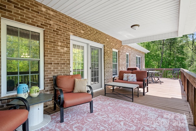 wooden terrace featuring outdoor lounge area