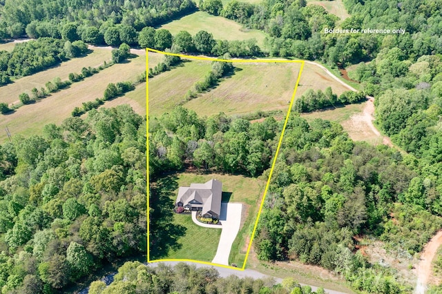 bird's eye view featuring a forest view