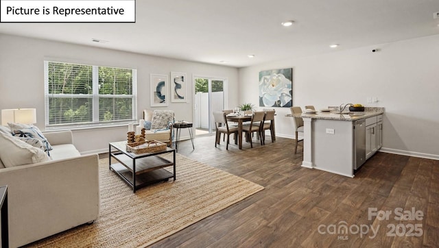 living area with baseboards, recessed lighting, visible vents, and dark wood-type flooring