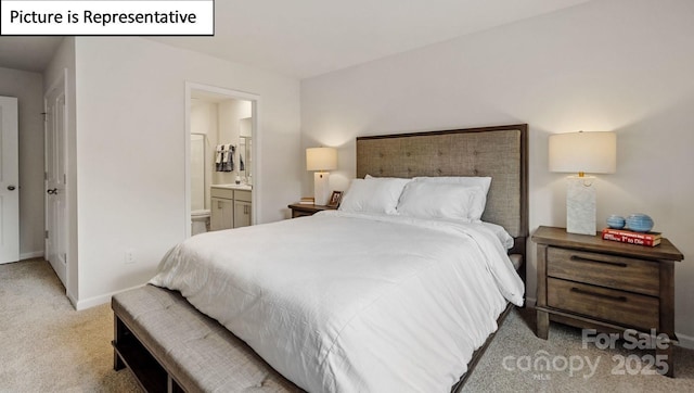 bedroom with light colored carpet, ensuite bath, and baseboards