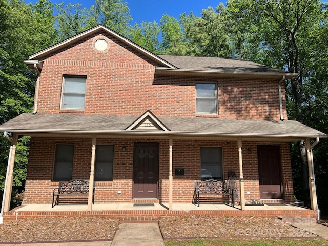 116 Fairview St, Shelby, NC 28152 - view of front of house featuring a porch, brick siding, and a shingled roof