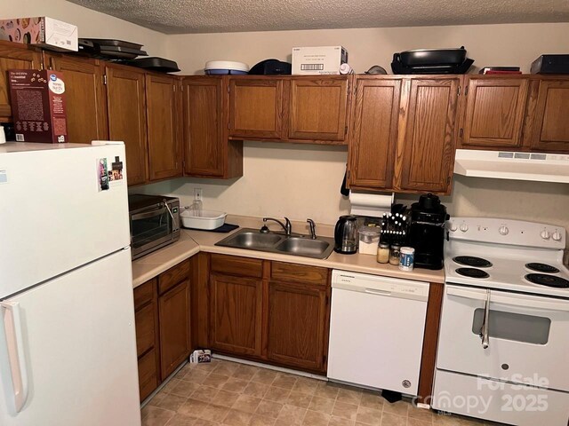 116 Fairview St, Shelby, NC 28152 - kitchen with white appliances, a sink, under cabinet range hood, light countertops, and a textured ceiling