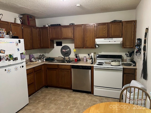 116 Fairview St, Shelby, NC 28152 - kitchen with white appliances, under cabinet range hood, light countertops, a sink, and a textured ceiling