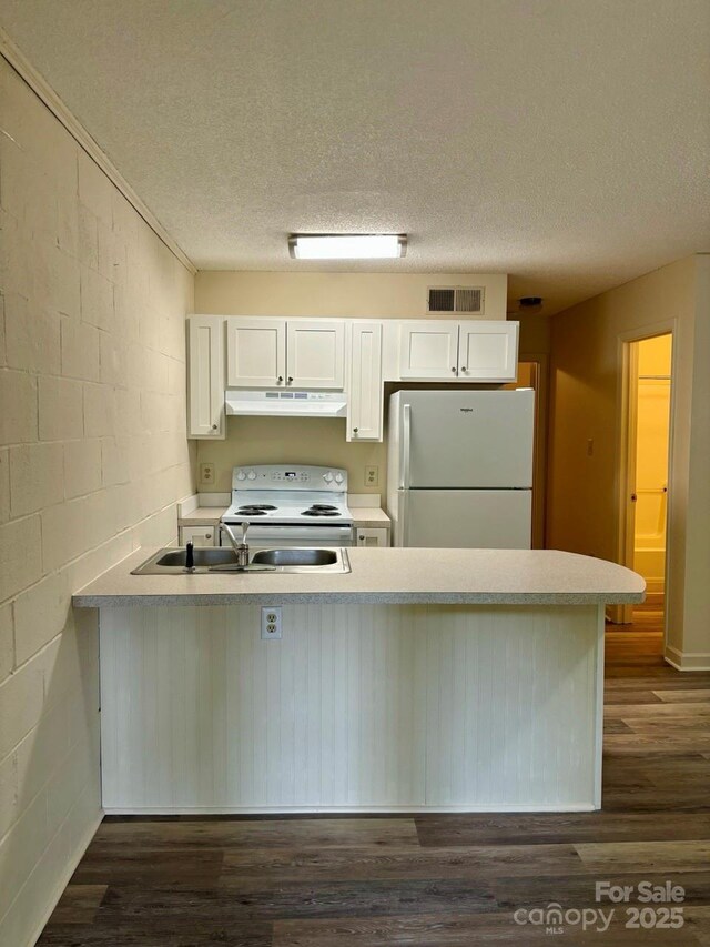 116 Fairview St, Shelby, NC 28152 - kitchen featuring white appliances, under cabinet range hood, a peninsula, white cabinets, and a textured ceiling