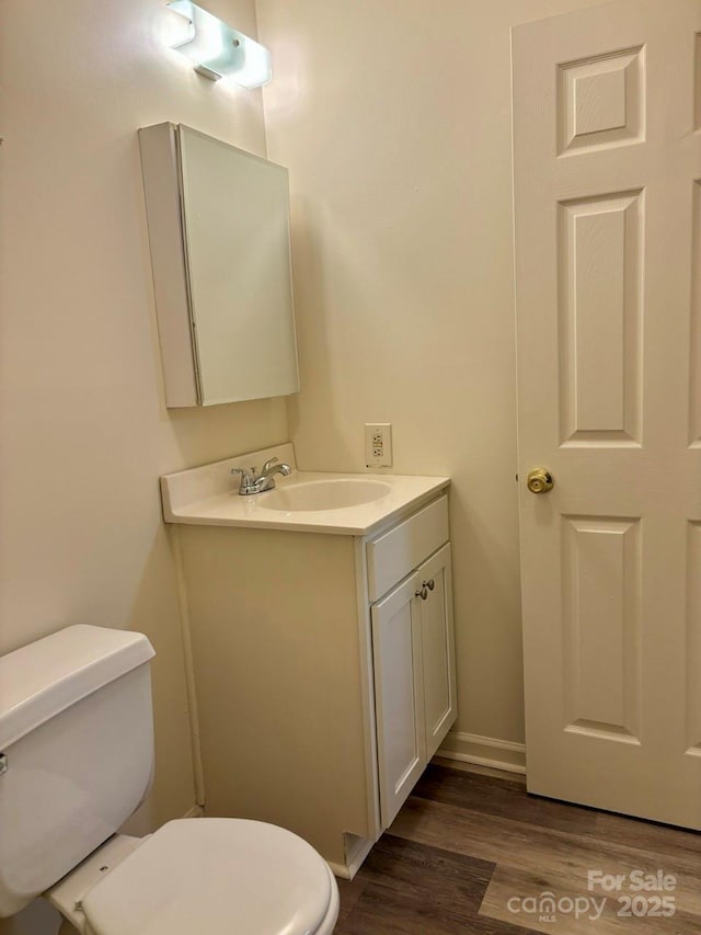 116 Fairview St, Shelby, NC 28152 - bathroom with toilet, wood finished floors, vanity, and baseboards