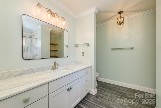 full bath with vanity, toilet, wood finished floors, baseboards, and ornamental molding