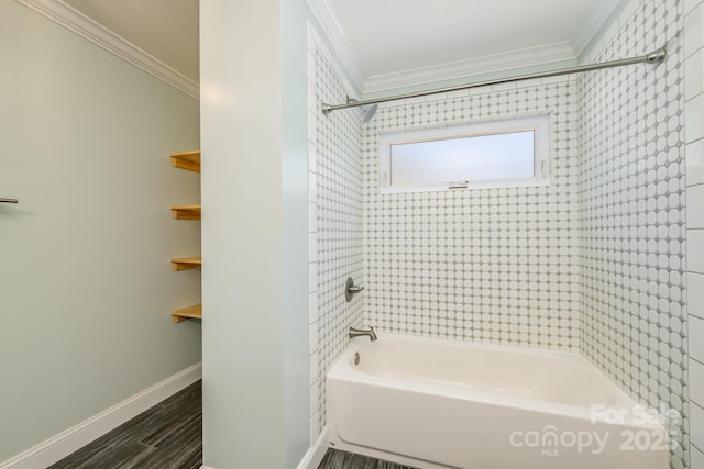 bathroom with ornamental molding, shower / bathtub combination, wood finished floors, and baseboards
