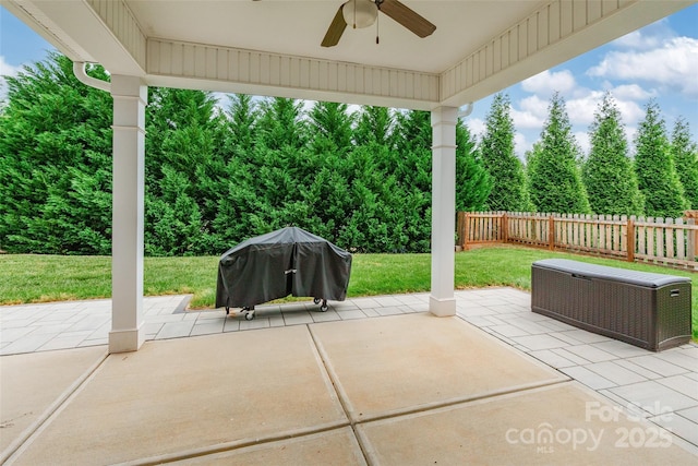 view of patio / terrace with fence, a ceiling fan, and area for grilling