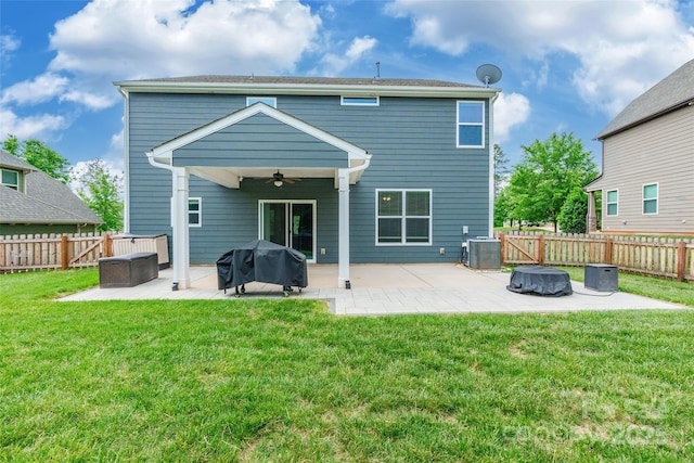 rear view of property featuring central AC, a ceiling fan, a fenced backyard, and a patio area