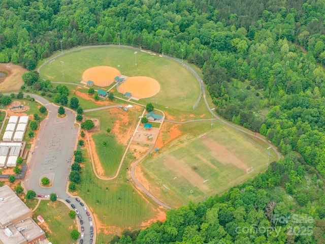 aerial view featuring a wooded view