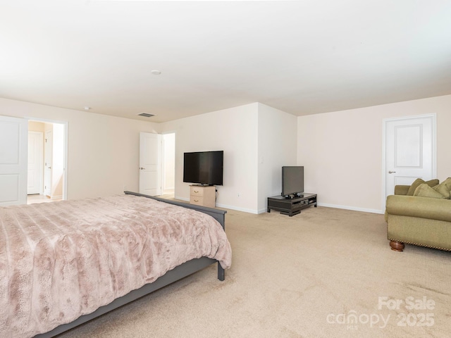 bedroom featuring light colored carpet, visible vents, and baseboards
