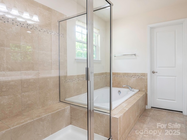 full bathroom with a garden tub and a stall shower