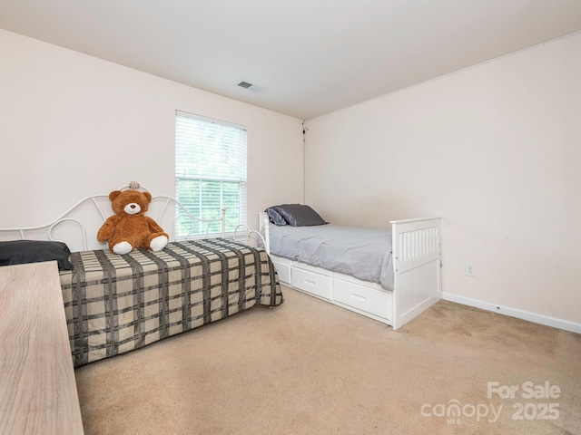 bedroom featuring carpet, baseboards, and visible vents